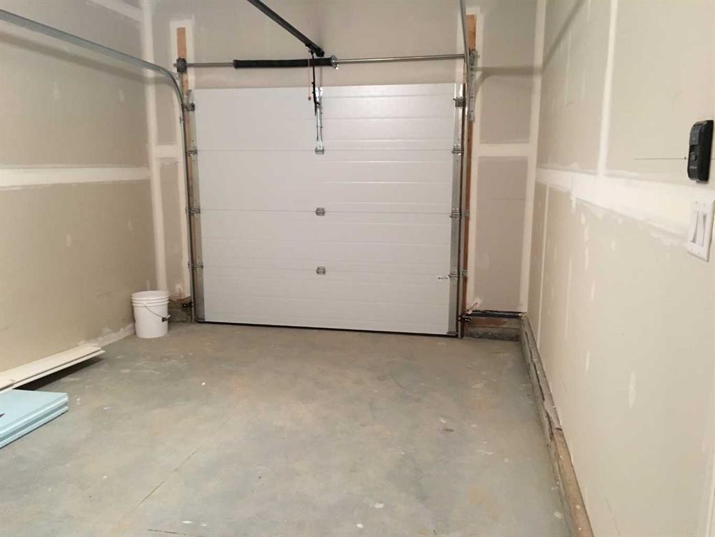 61 Maclean Close, Blackfalds, AB - Indoor Photo Showing Garage