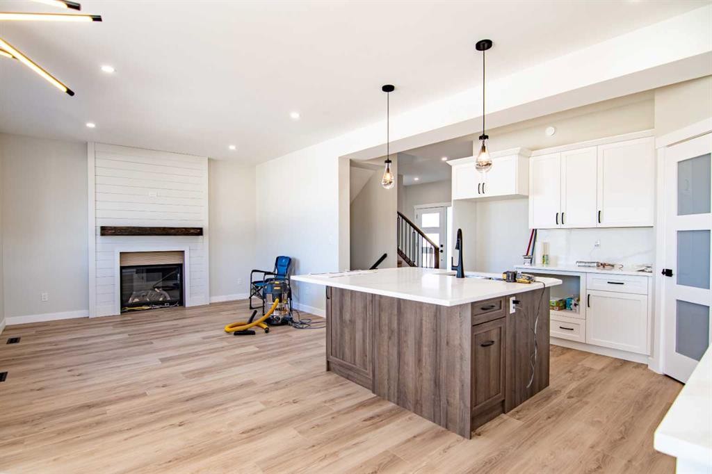 29 Vintage Close, Blackfalds, AB - Indoor Photo Showing Kitchen With Fireplace