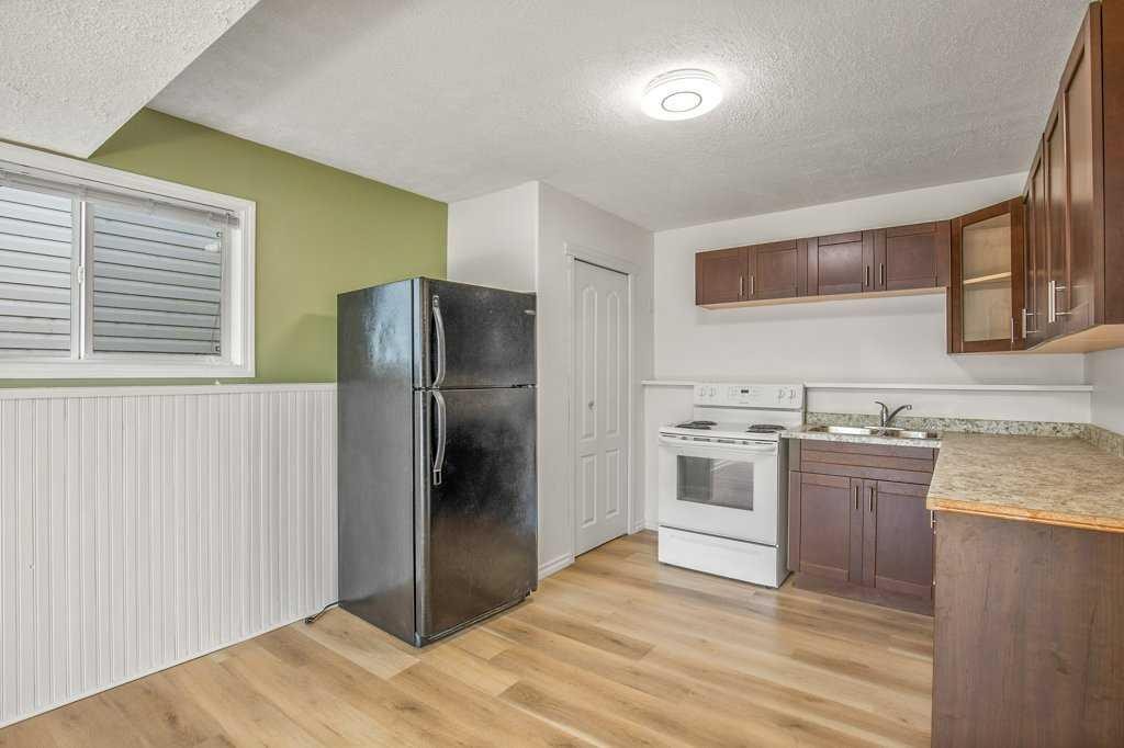52 Harper Drive, Sylvan Lake, AB - Indoor Photo Showing Kitchen With Double Sink
