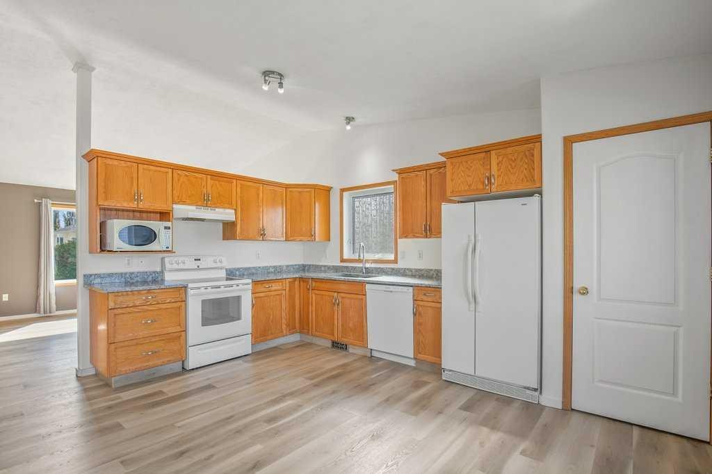 52 Harper Drive, Sylvan Lake, AB - Indoor Photo Showing Kitchen With Double Sink