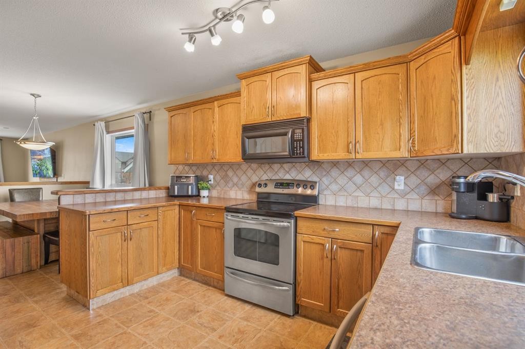 56 Ironstone Drive, Red Deer, AB - Indoor Photo Showing Kitchen With Double Sink