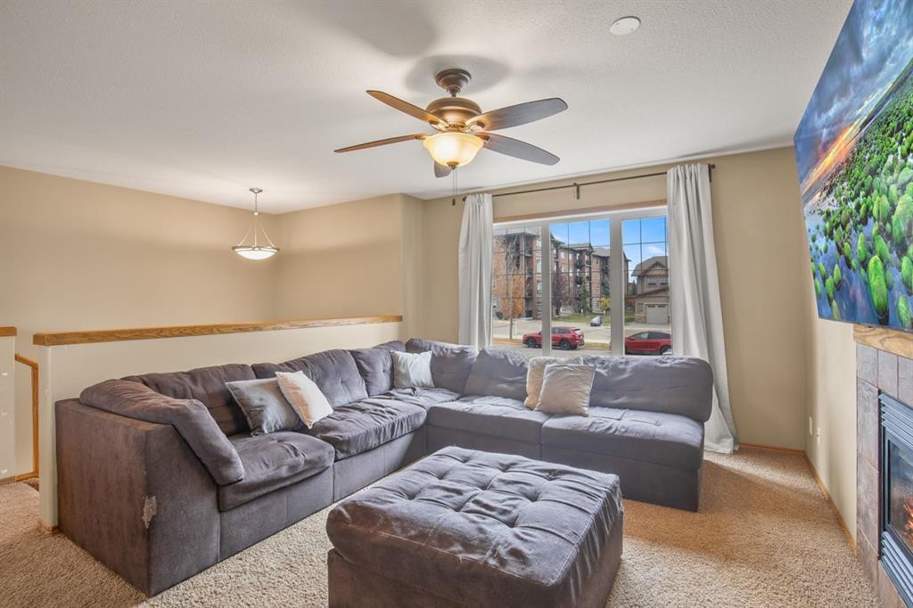 56 Ironstone Drive, Red Deer, AB - Indoor Photo Showing Living Room With Fireplace