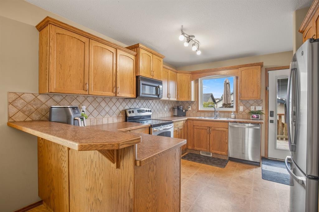 56 Ironstone Drive, Red Deer, AB - Indoor Photo Showing Kitchen With Double Sink