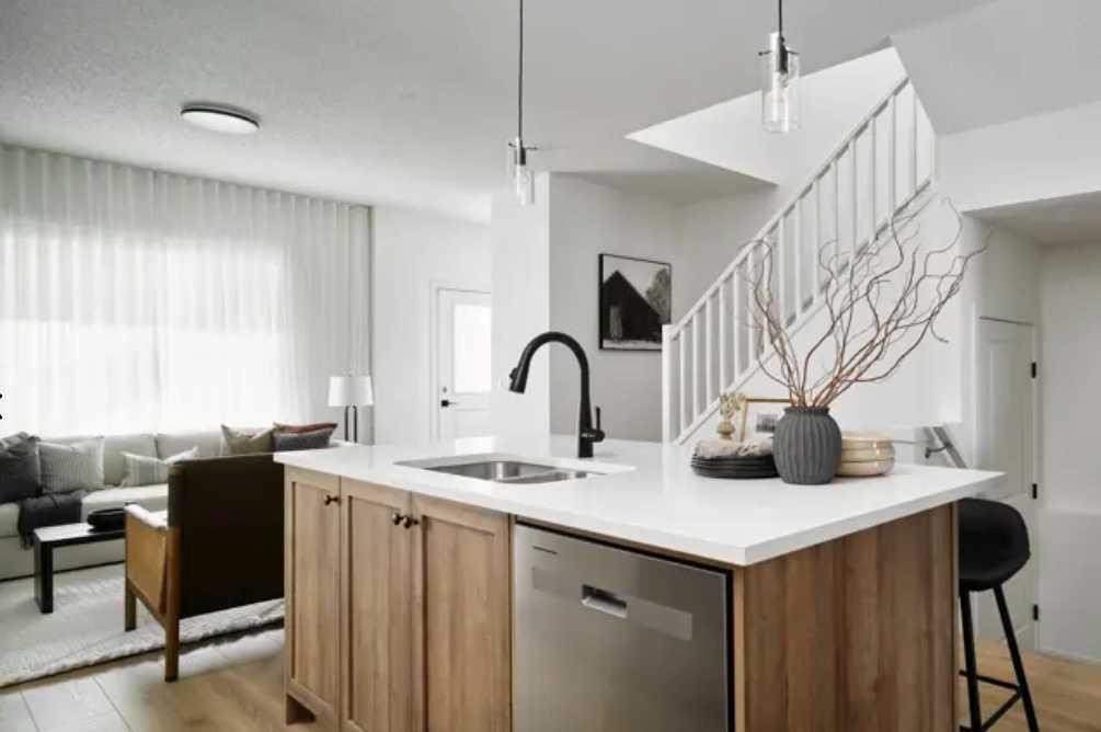 21 Emberside Park, Cochrane, AB - Indoor Photo Showing Kitchen With Double Sink With Upgraded Kitchen