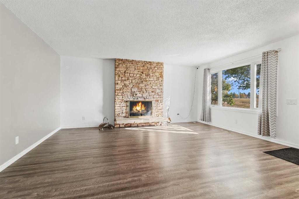 844 Rundlecairn Way Ne, Calgary, AB - Indoor Photo Showing Living Room With Fireplace