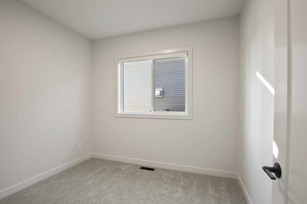 151 Cedar Square, Blackfalds, AB - Indoor Photo Showing Other Room