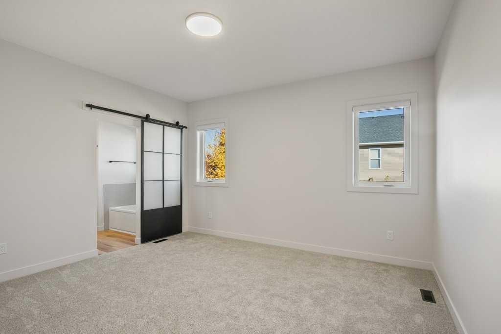 151 Cedar Square, Blackfalds, AB - Indoor Photo Showing Other Room