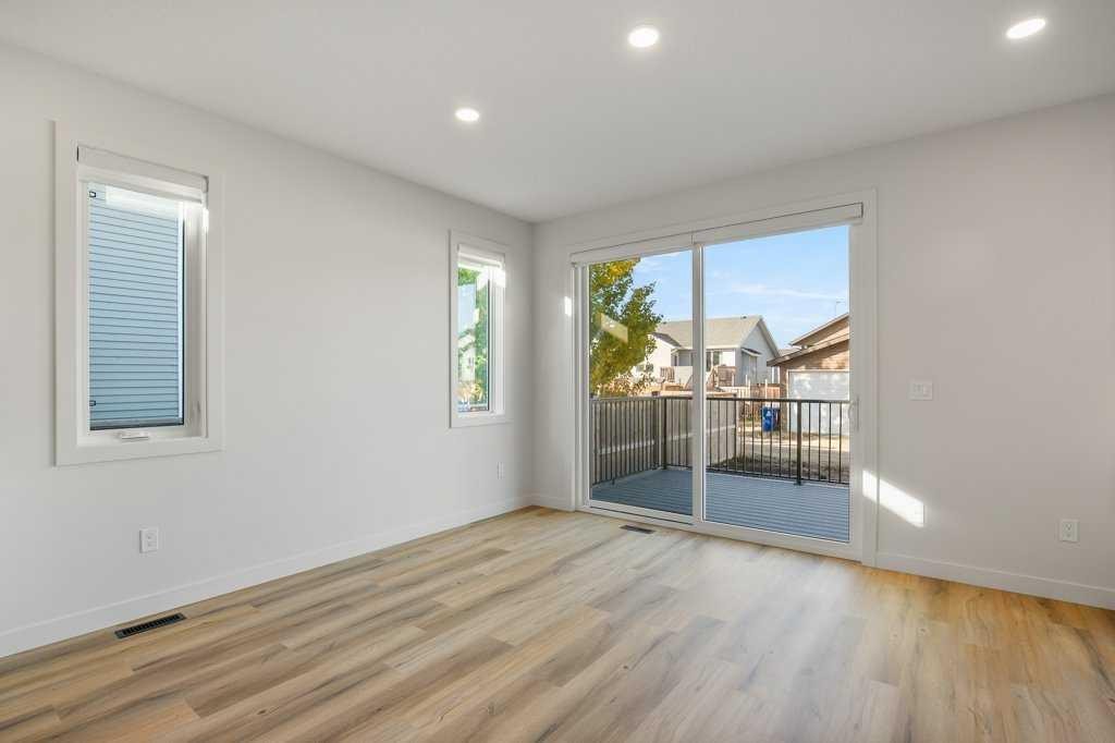 151 Cedar Square, Blackfalds, AB - Indoor Photo Showing Other Room