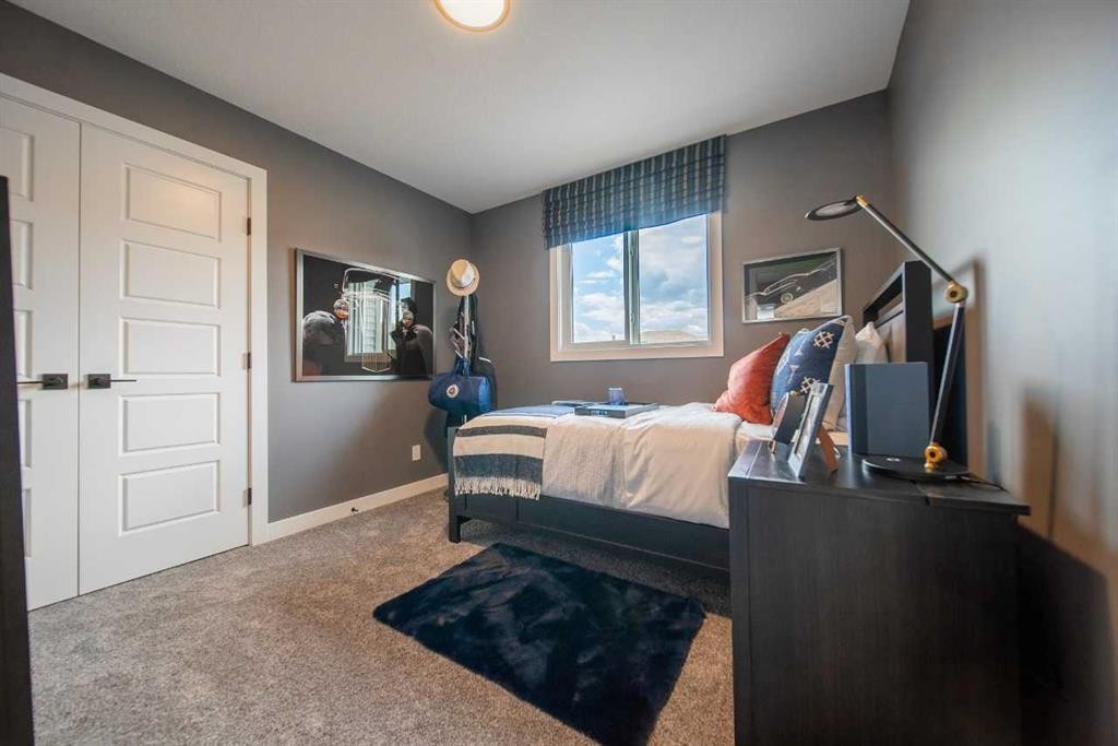 704 Langley Terrace Se, Airdrie, AB - Indoor Photo Showing Bedroom