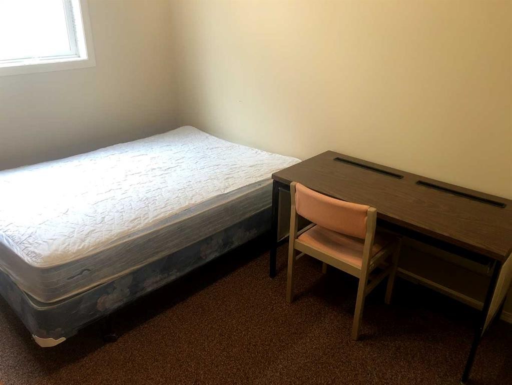 7017 Deer Street, Lacombe, AB - Indoor Photo Showing Bedroom
