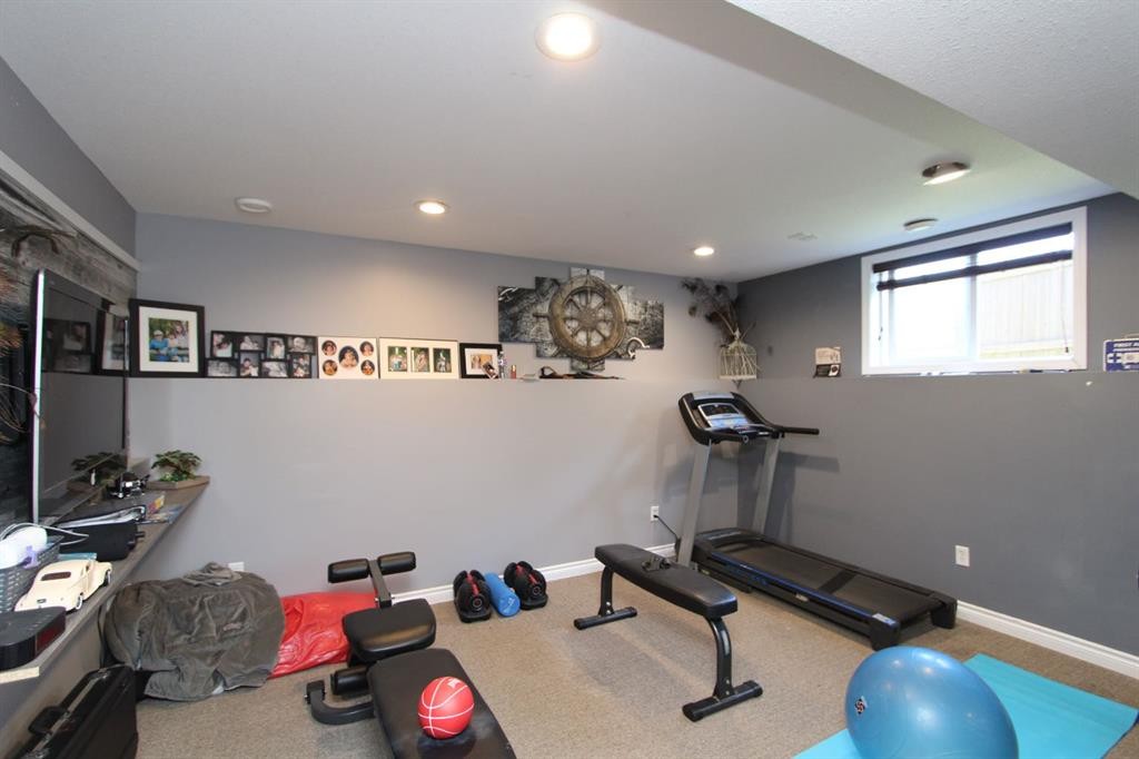 26 Wilkinson Circle, Sylvan Lake, AB - Indoor Photo Showing Gym Room