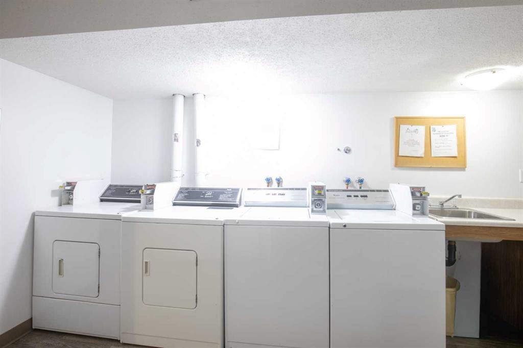 101-304-5904 51 Avenue, Red Deer, AB - Indoor Photo Showing Laundry Room