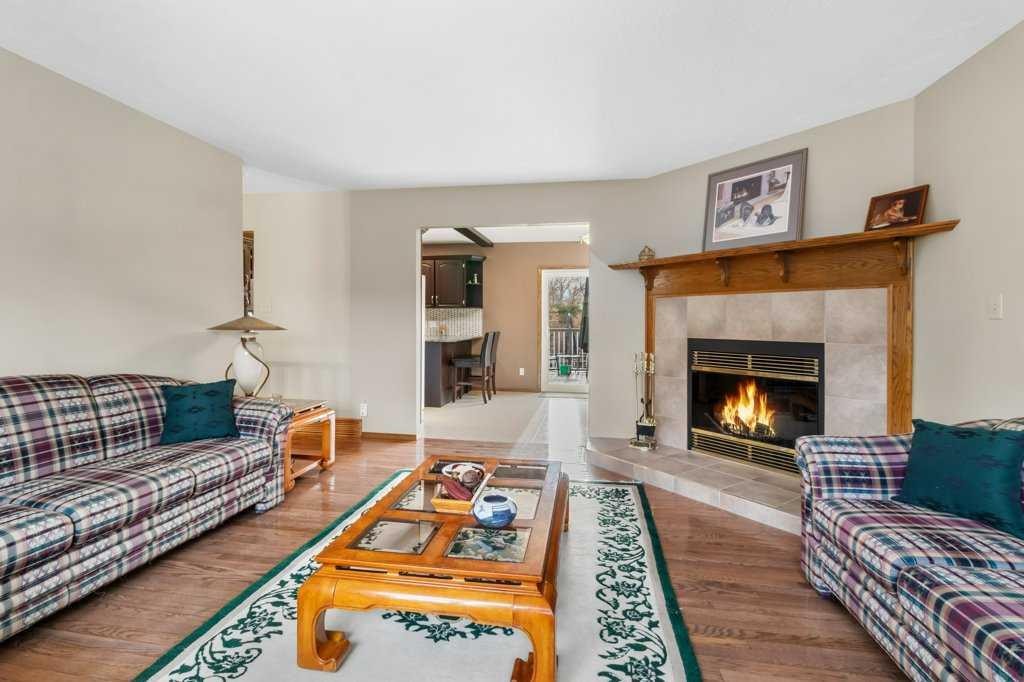45 Ravenscrag Crescent North, Norglenwold, AB - Indoor Photo Showing Living Room With Fireplace