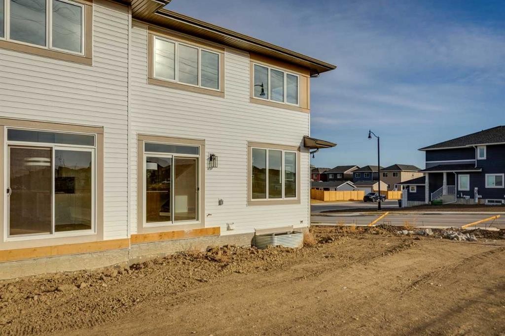 303 Dawson Dock Way, Chestermere, AB - Outdoor With Exterior