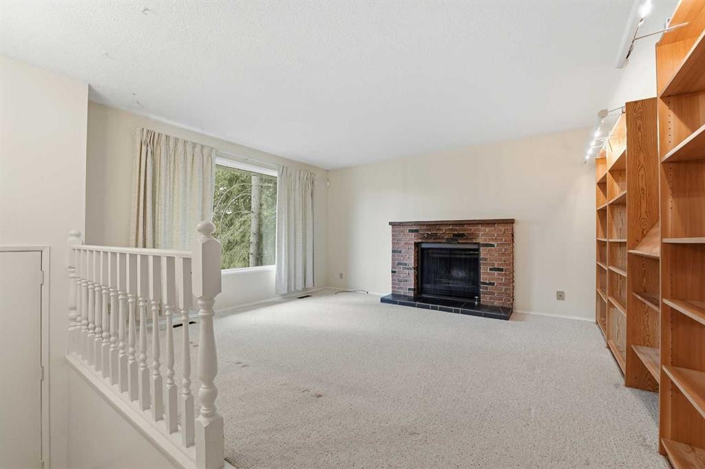 49 Pamely Avenue, Red Deer, AB - Indoor With Fireplace