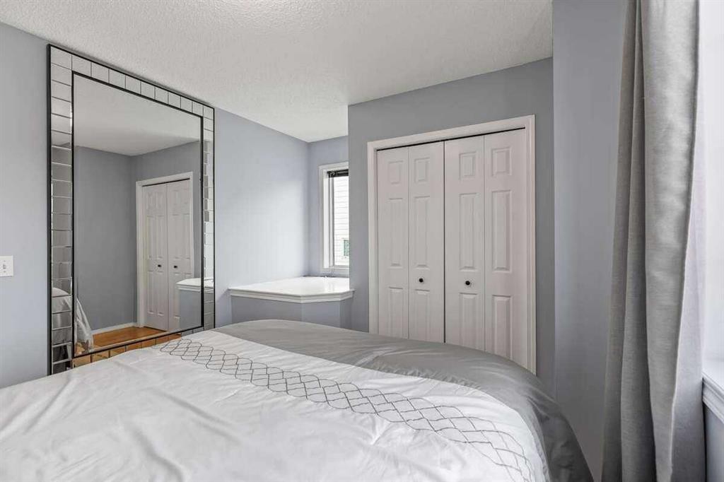 60 Bridlecreek Terrace Sw, Calgary, AB - Indoor Photo Showing Bedroom
