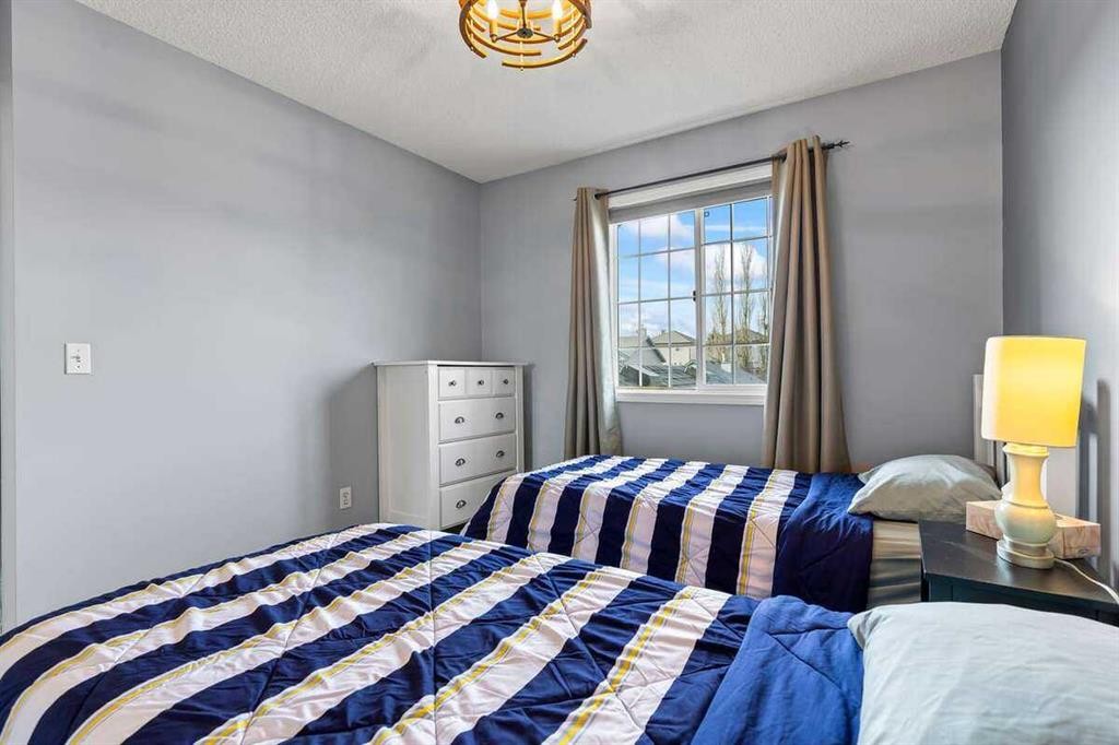 60 Bridlecreek Terrace Sw, Calgary, AB - Indoor Photo Showing Bedroom