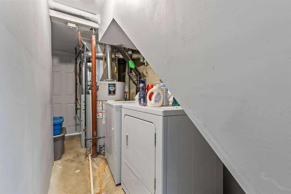 60 Bridlecreek Terrace Sw, Calgary, AB - Indoor Photo Showing Laundry Room