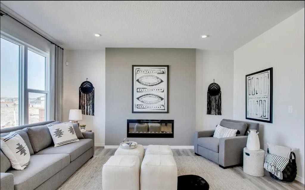 89 Creekstone Grove Sw, Calgary, AB - Indoor Photo Showing Living Room With Fireplace