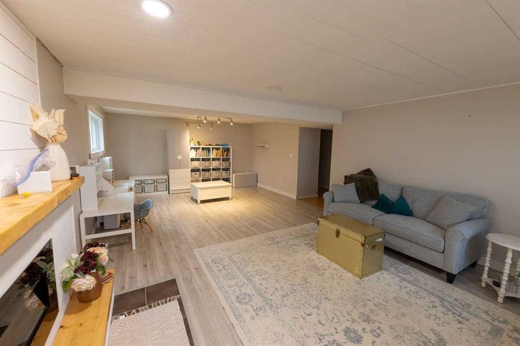 10620 103 Street Close, Fairview, AB - Indoor Photo Showing Living Room With Fireplace