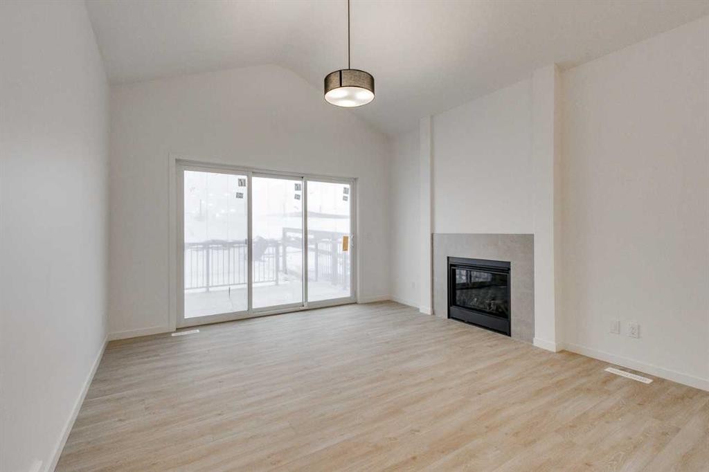 75 Fireside Common, Cochrane, AB - Indoor With Fireplace