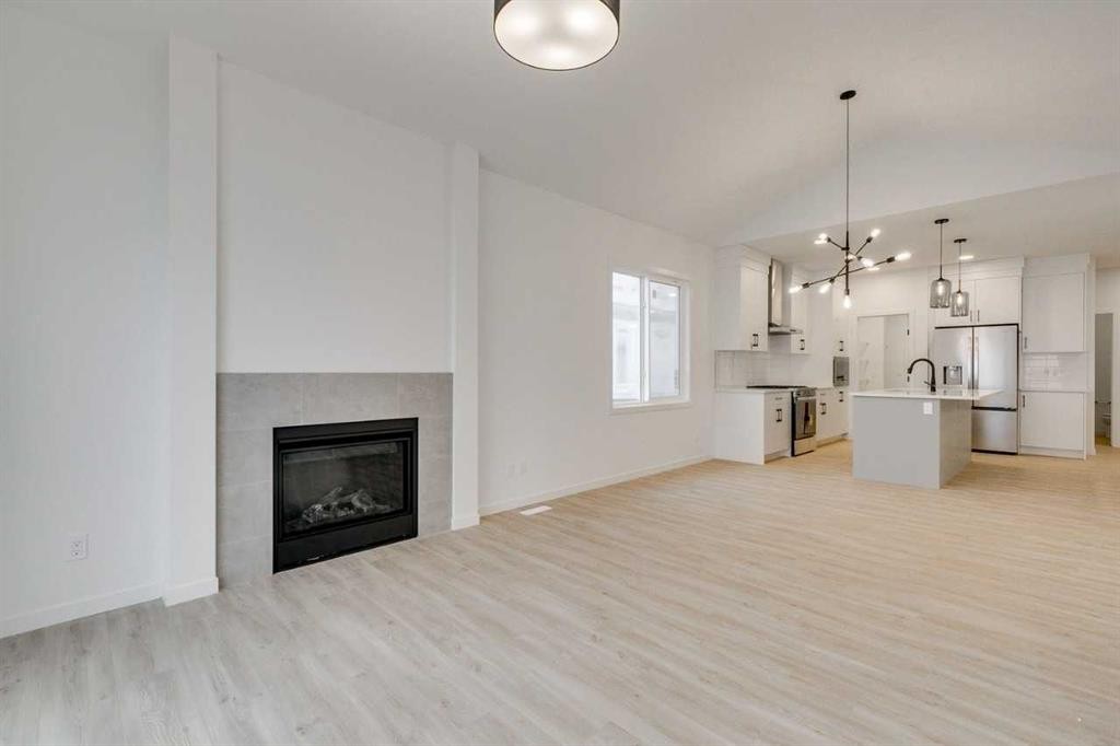 75 Fireside Common, Cochrane, AB - Indoor With Fireplace