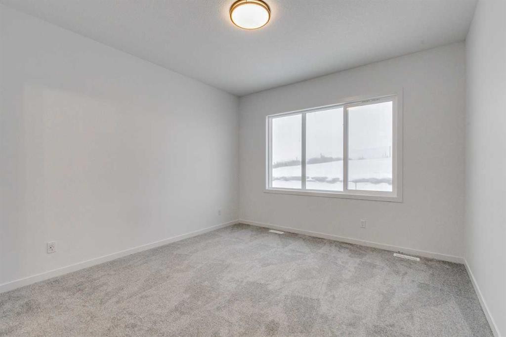 75 Fireside Common, Cochrane, AB - Indoor Photo Showing Other Room