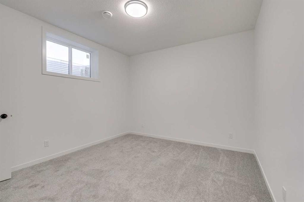 75 Fireside Common, Cochrane, AB - Indoor Photo Showing Other Room