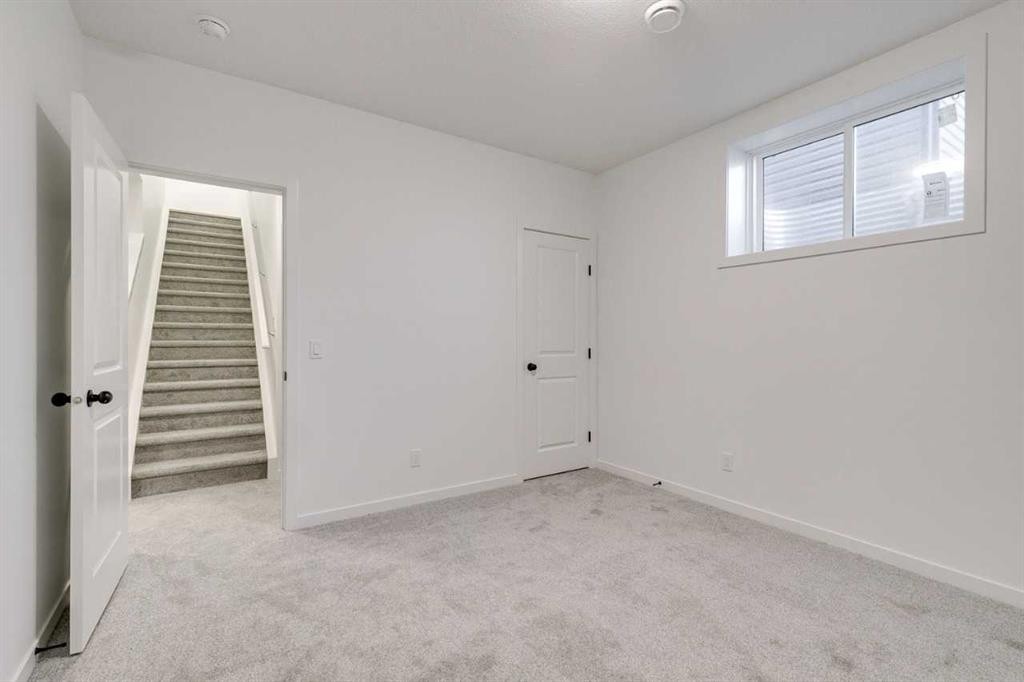 75 Fireside Common, Cochrane, AB - Indoor Photo Showing Other Room