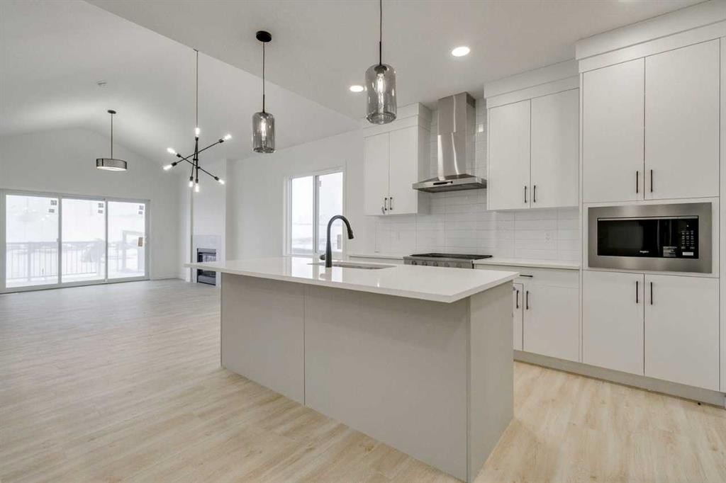 75 Fireside Common, Cochrane, AB - Indoor Photo Showing Kitchen With Upgraded Kitchen