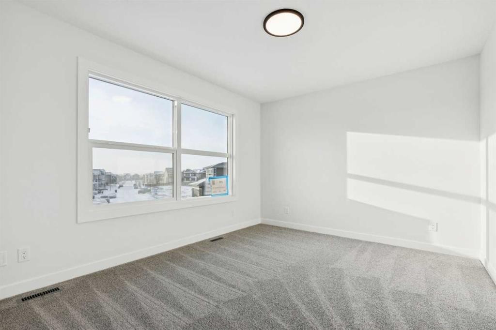 199 Langwell Common Se, Airdrie, AB - Indoor Photo Showing Other Room