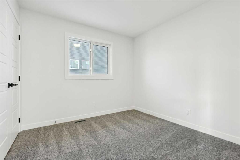 199 Langwell Common Se, Airdrie, AB - Indoor Photo Showing Other Room