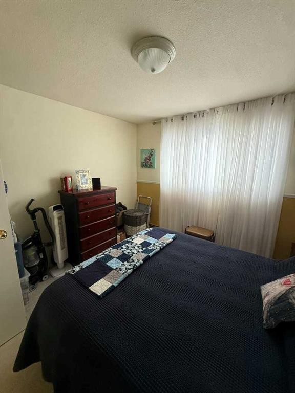 201-5519 Kerry Wood Drive, Red Deer, AB - Indoor Photo Showing Bedroom