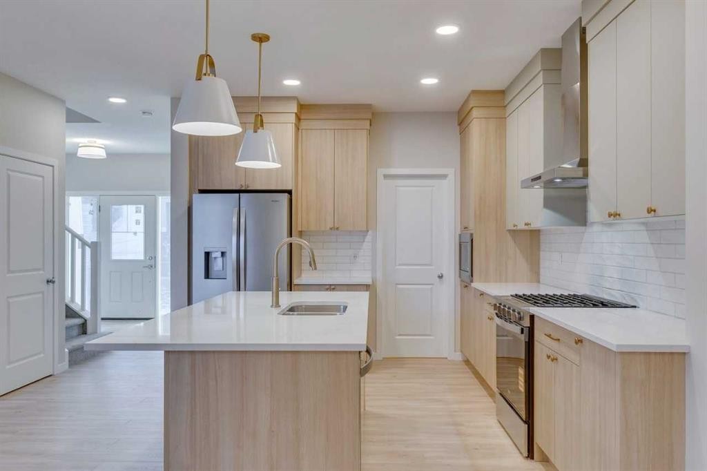 82 Alpine Common Sw, Calgary, AB - Indoor Photo Showing Kitchen With Double Sink With Upgraded Kitchen