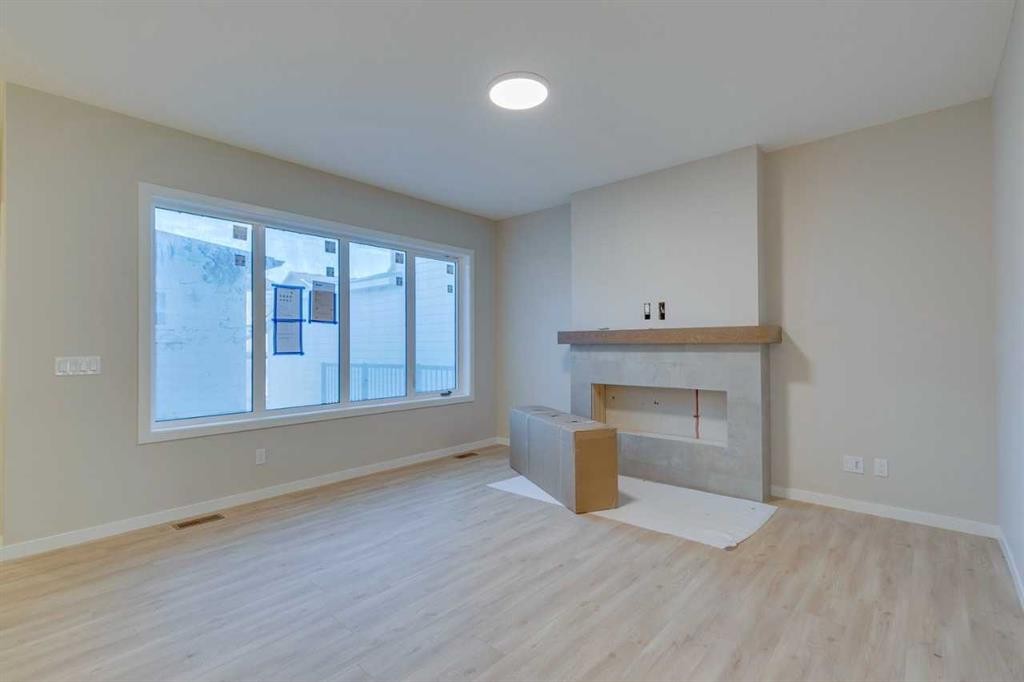 82 Alpine Common Sw, Calgary, AB - Indoor With Fireplace