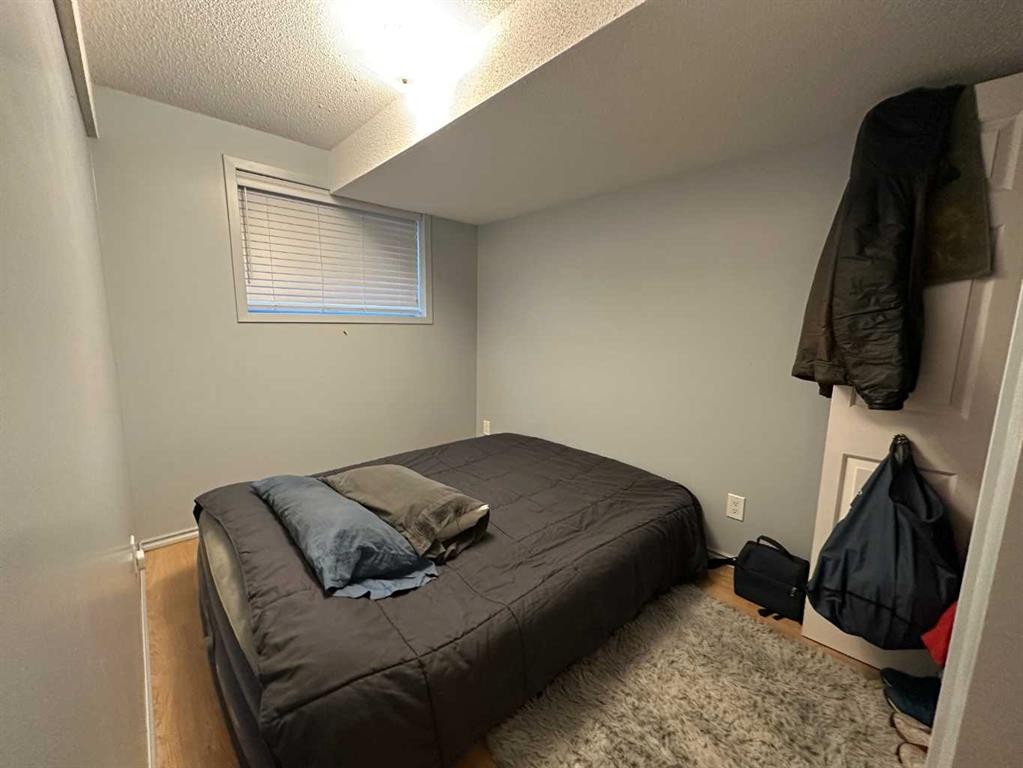 A & B-4923 53 Street, Rocky Mountain House, AB - Indoor Photo Showing Bedroom