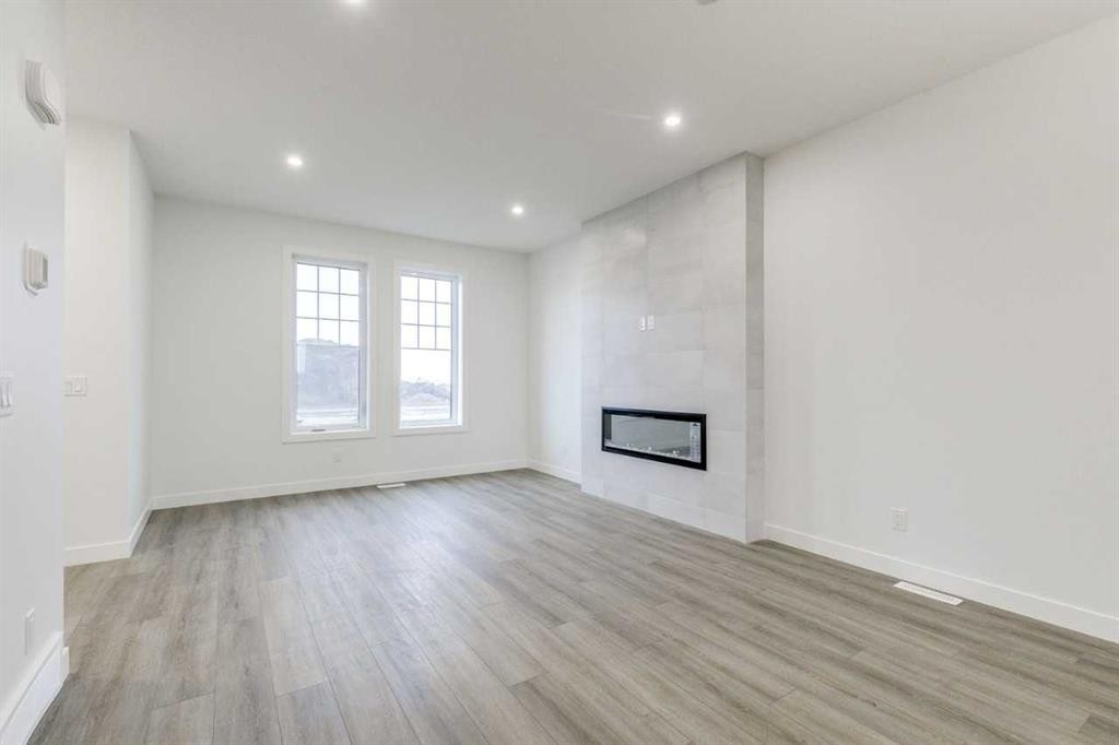 221 Bridgeport Gate Sw, Chestermere, AB - Indoor With Fireplace