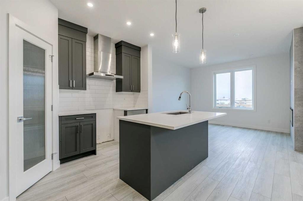 205 Bridgeport Gate, Chestermere, AB - Indoor Photo Showing Kitchen With Upgraded Kitchen
