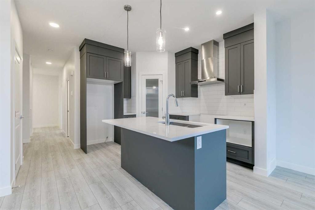 205 Bridgeport Gate, Chestermere, AB - Indoor Photo Showing Kitchen With Upgraded Kitchen