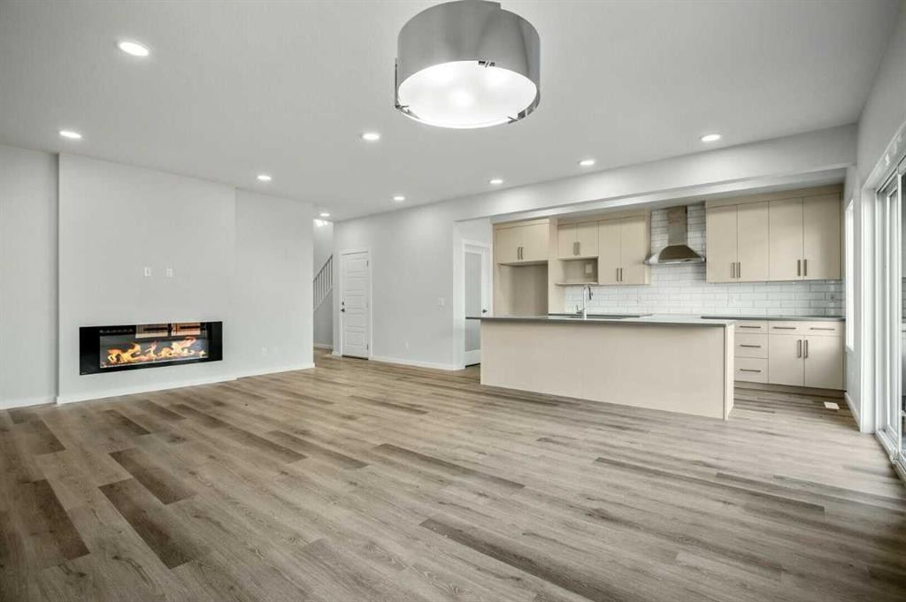 18 Heartwood Villas Se, Calgary, AB - Indoor Photo Showing Other Room With Fireplace