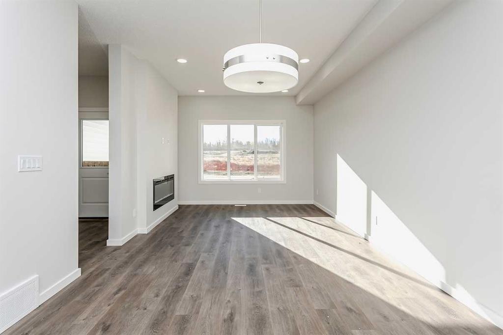 147 Lincoln Crescent, Rural Red Deer County, AB - Indoor Photo Showing Other Room With Fireplace
