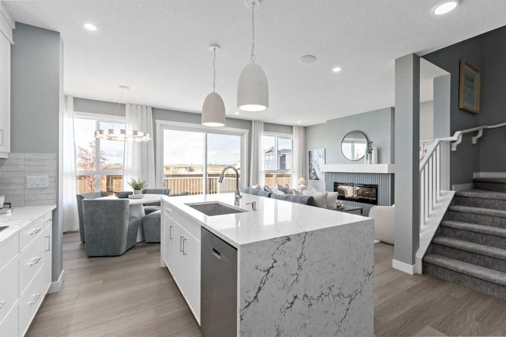 207 Huxland Path, Calgary, AB - Indoor Photo Showing Kitchen With Fireplace With Upgraded Kitchen