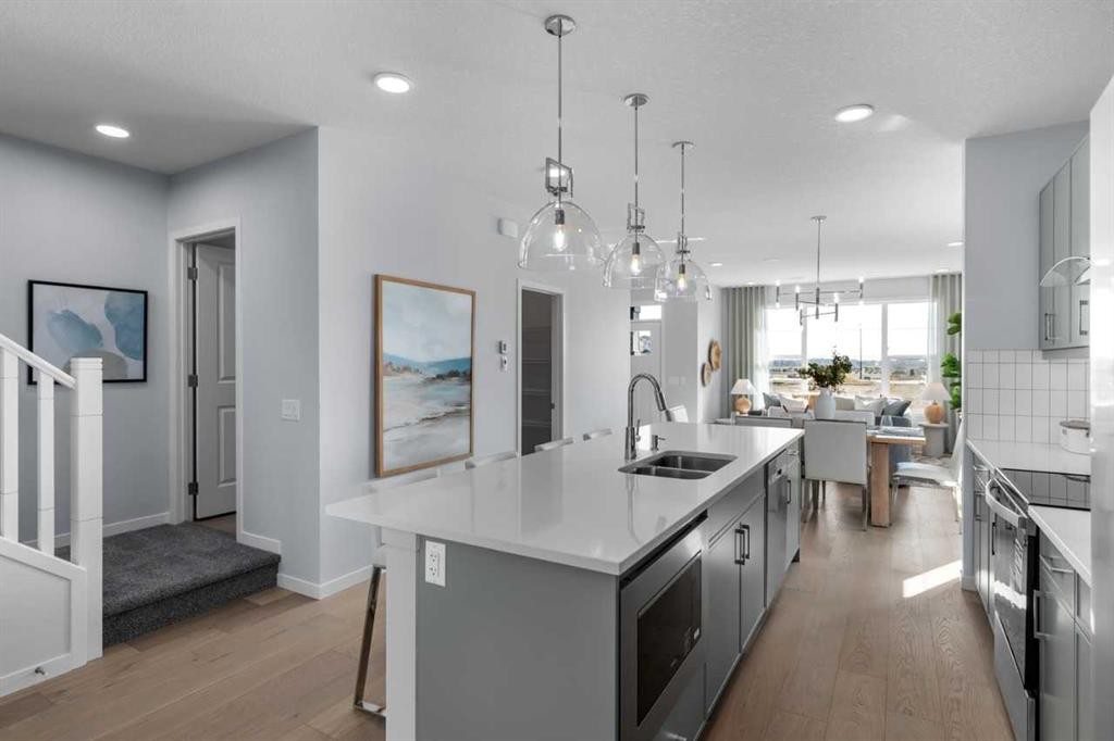 139 Huxland Road Ne, Calgary, AB - Indoor Photo Showing Kitchen With Double Sink With Upgraded Kitchen