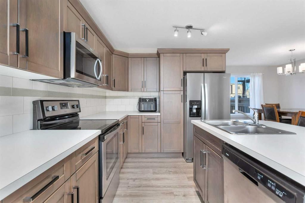 22 Latoria Court, Rural Red Deer County, AB - Indoor Photo Showing Kitchen With Double Sink With Upgraded Kitchen