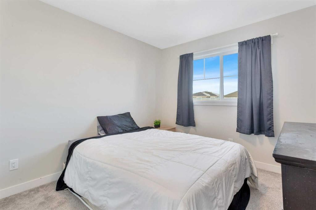 22 Latoria Court, Rural Red Deer County, AB - Indoor Photo Showing Bedroom