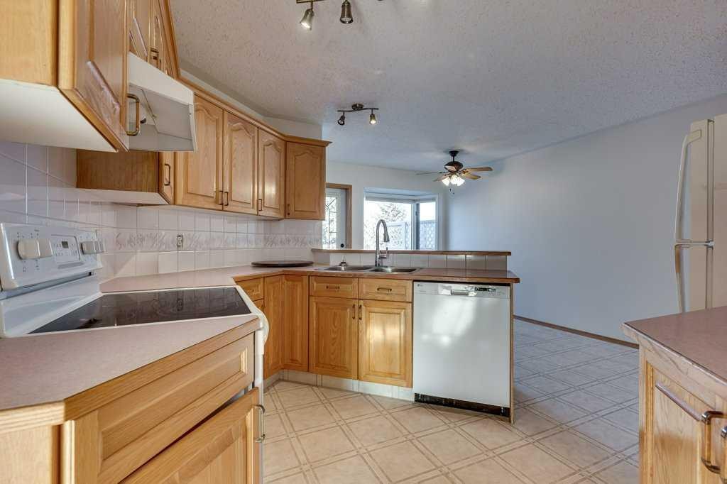 16 Lawrence Crescent, Red Deer, AB - Indoor Photo Showing Kitchen With Double Sink