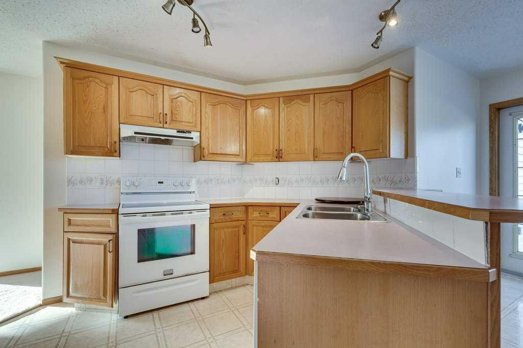 16 Lawrence Crescent, Red Deer, AB - Indoor Photo Showing Kitchen With Double Sink