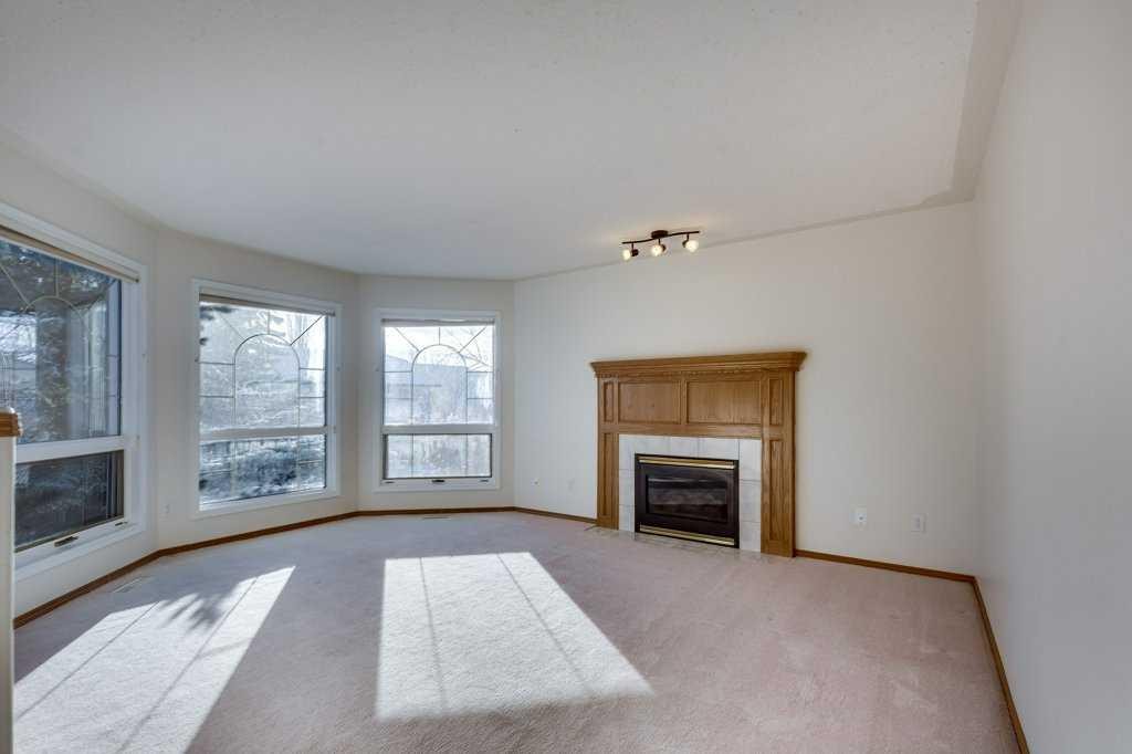16 Lawrence Crescent, Red Deer, AB - Indoor Photo Showing Living Room With Fireplace