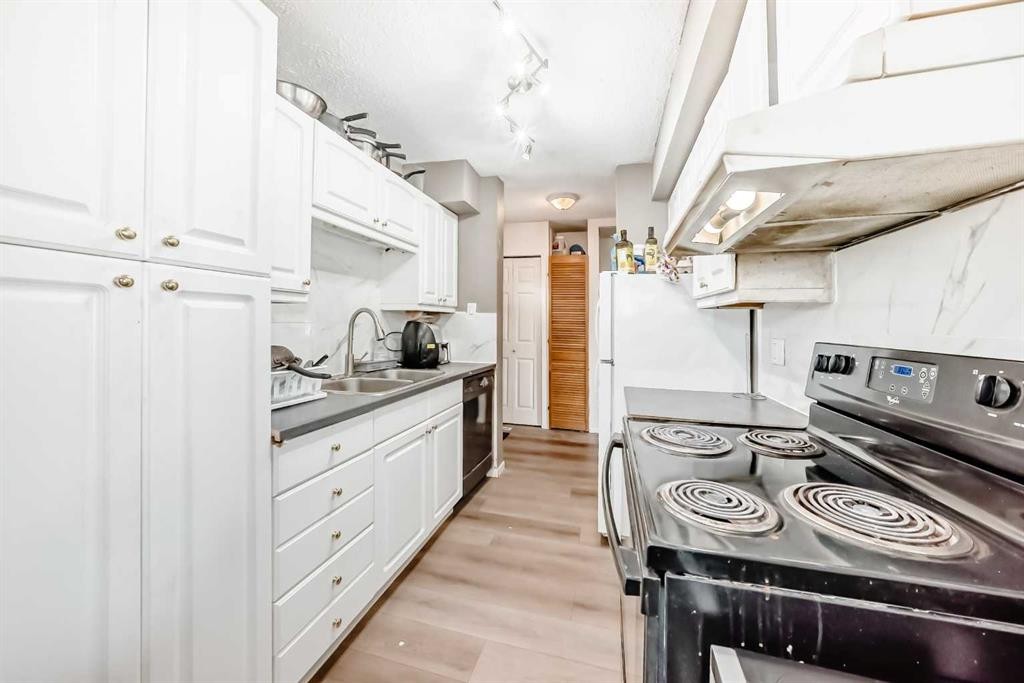 B1-35 Nash, Red Deer, AB - Indoor Photo Showing Kitchen With Double Sink