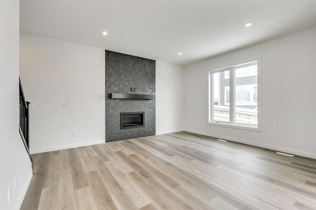 285 Creekstone Hill Sw, Calgary, AB - Indoor Photo Showing Living Room With Fireplace